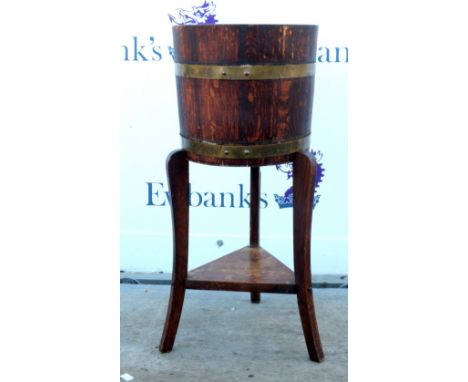 19th century mahogany brass bound barrel planter on tripod supports. 70H        