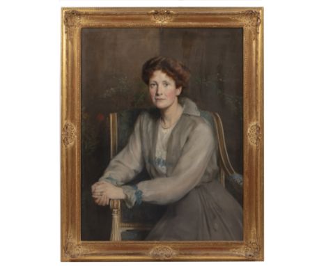 John Collier (1850-1934)Portrait of Mrs Frances Russell-Clarke, nee Daubeny, seated on a gilt chair and wearing a pale blue d