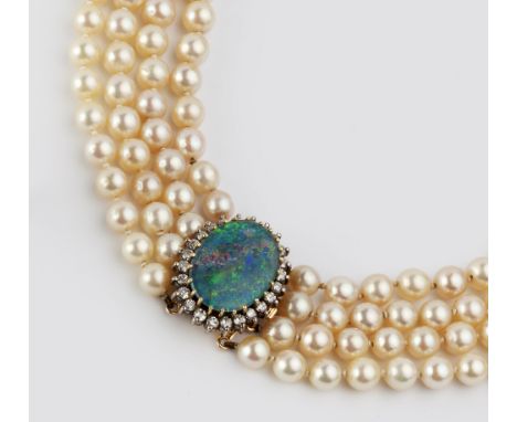 A CULTURED PEARL MULTI-STRAND NECKLACE WITH DETACHABLE DIAMOND AND GEM SET CLASP, comprising four strands of graduated cultur