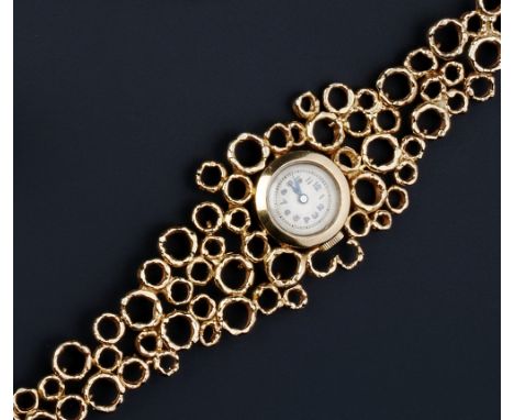 A LADY'S 9CT GOLD BRACELET WATCH BY JOHN DONALD, the circular silvered dial with Arabic numerals, blued steel hands and outer