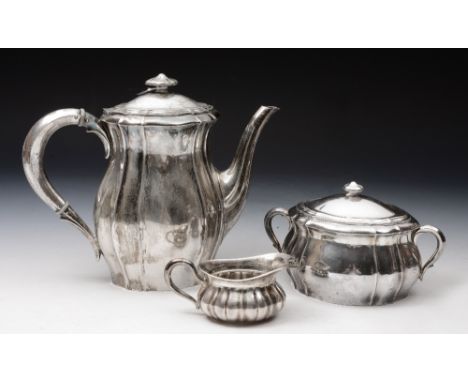 A GERMAN THREE PIECE COFFEE SERVICE comprising coffee pot, twin handled sucrier and cover, and cream jug of shaped oval form,