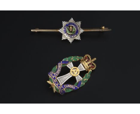 TWO ENAMEL REGIMENTAL BROOCHES BY GARRARD & CO. LTD, the first an openwork panel brooch for The Queen Alexandra's Royal Army 