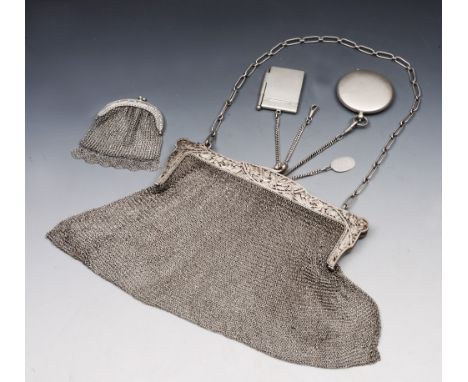 A CONTINENTAL 800 GRADE SILVER PURSE with pierced foliate decorated frame and mesh body, 20cm wide, with attached notepad hol