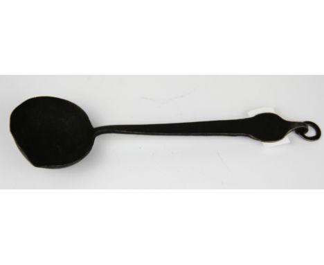 A Tibetan 19th C. hammered iron ladle, L. 23cm.