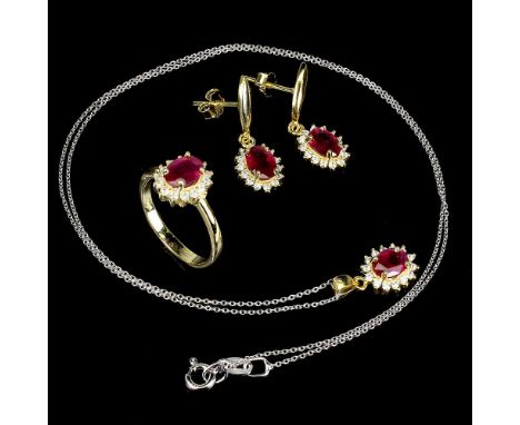 A suite of matching 925 silver gilt ring, pair of earrings and pendant and chain, set with rubies and white stones.
