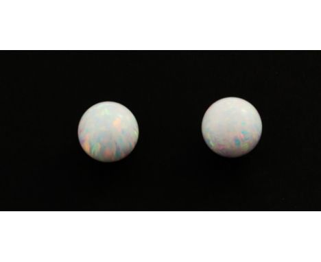 A pair of 9ct yellow gold opal set stud earrings, Dia. 0.8cm.