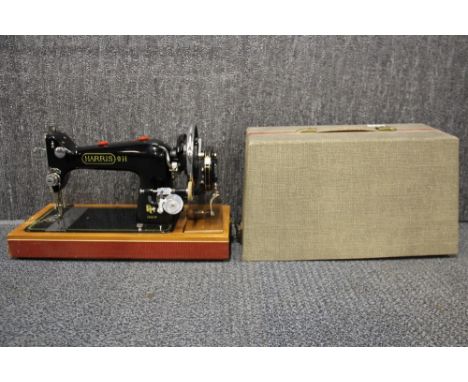 A vintage Harris hand crank sewing machine.