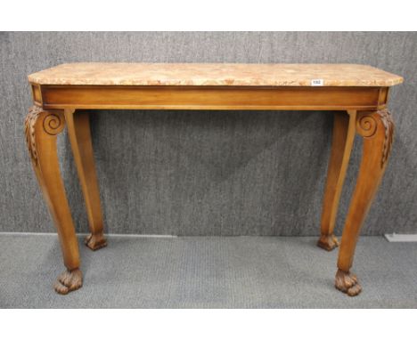 A 20th C. carved wooden double sided console with marble top, W. 131 X 49 x 89cm.