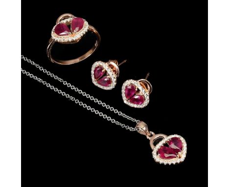 A matching suite of ring, pair of earrings and pendant and chain set with pear cut rubies and white stones.