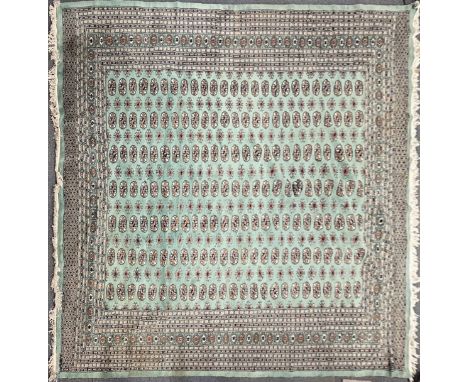 A heavy green ground eastern wool carpet, 280 375cm