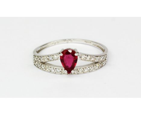 A 18ct white gold ring set with a pear cut unheated ruby and diamond set shoulders, approx. 0.45ct ruby and 0.21ct diamonds, 