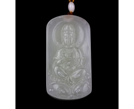 A Chinese carved mutton fat jade amulet of Guanyin, L. 6.5cm.
