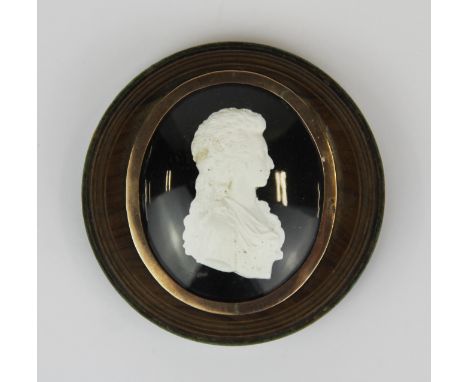 An interesting rose metal mounted (possibly gold) cameo portrait of Queen Charlotte, with a hand painted reverse, Dia. 6.5cm.