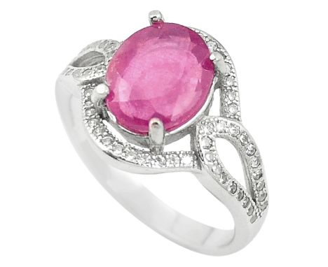 A 925 silver ring set with an oval cut rubi and white stones, (P).