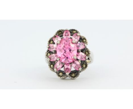 A 925 silver marcasite and pink stone set ring, (O).