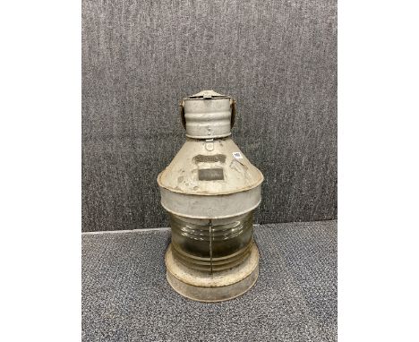 An antique ships mask head lamp, H. 58cm.
