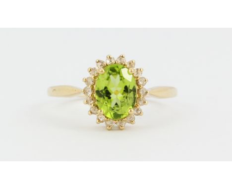 A 9ct yellow gold peridot and rose cut diamond set cluster ring, (M).