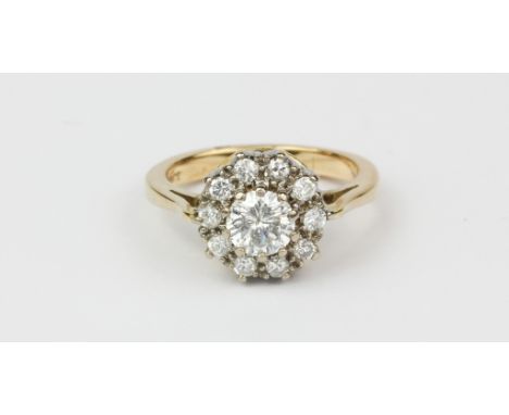 A 9ct yellow gold diamond set cluster ring, approx. 1ct overall, (L).