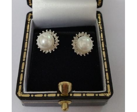 A Pair of White Gold Diamond and Pearl Earrings.