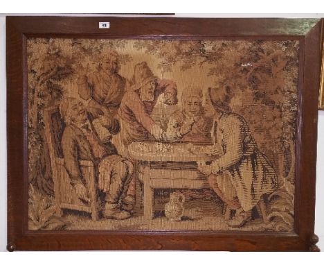 A 19th Century Tapestry 'The Card Players'; in an Oak frame.