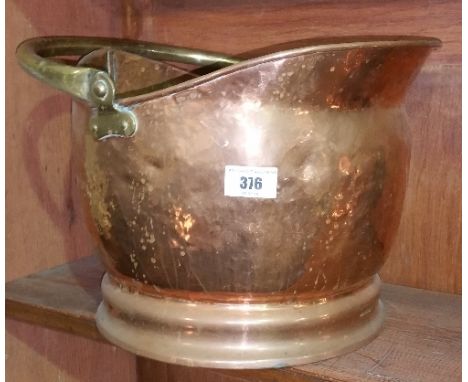 A 19th Century Copper Coal Helmet.