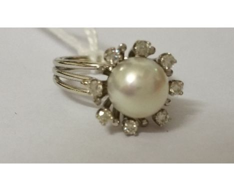 An 18ct Antique Diamond and Pearl Ring.