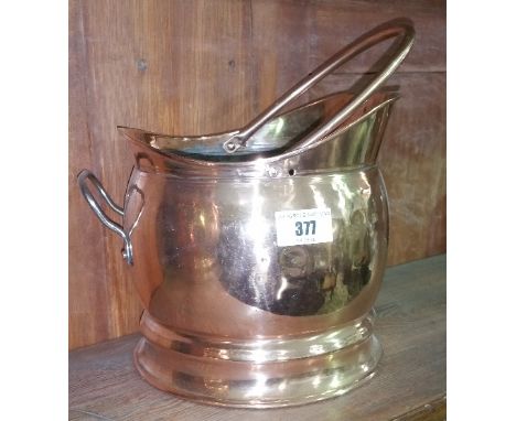 A 19th Century Copper Coal Helmet.