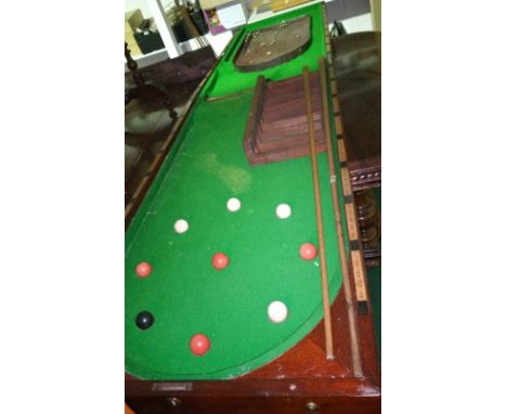 A Mahogany Folding Bagatelle Table, 19th Century, with balls and cues together with a smaller vintage game (2).