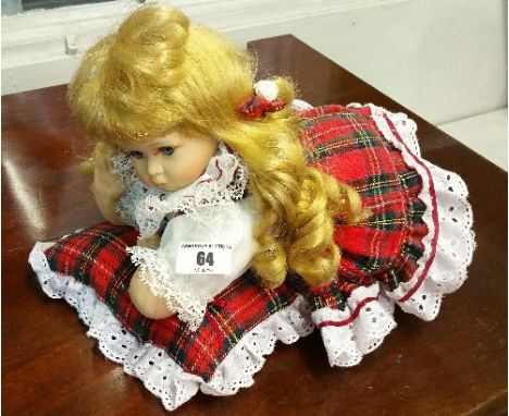 A Porcelain Doll with Cushion.