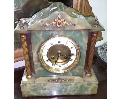 A Green Alabaster Mantle Clock, with reeded brass pillars, with pendulum and key.