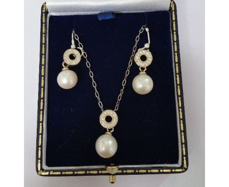 A Pair of Silver Pearl Set Earring along with a Matching Pendant.