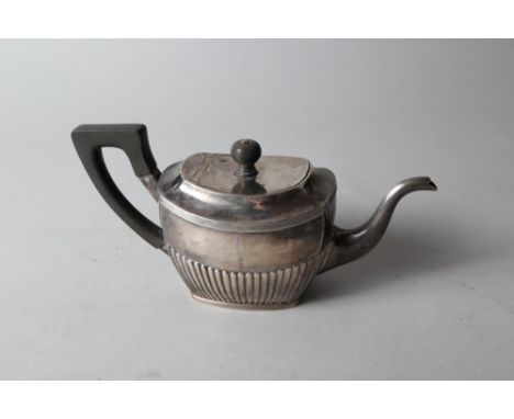 A Dutch 1st grade silver teapot with half-fluted body and ebonised handle, 13.1oz troy approx 