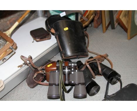 A pair of R E L Canada 7x50 binoculars, in case, another pair of binoculars, a Kodak Six-20 Junior camera, another camera and