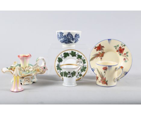A late 18th century Caughley blue and white bird decorated tea bowl, a Coalport style candlestick snuffer and two coffee cans