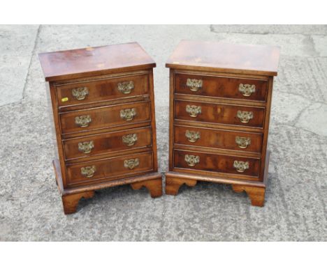 A pair of yew wood and banded miniature chests of four long drawers, on bracket supports, 17" wide x 13" deep x 25" highCondi