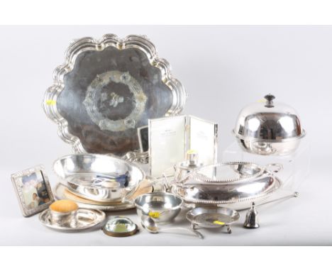 A silver plated pie crust salver, a plated entree dish and cover, a plated tea caddy, a plated muffin dish and other plated i