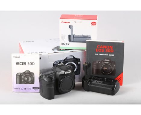 A Canon EOS 50D camera body and battery grip BGE2 with original boxes, manuals and cables 