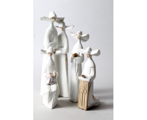 Four Lladro "nun" figures, tallest 13" high (three boxed)Condition:One of the shorter figures has had her head off.Others are