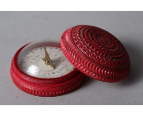 A 19th century turned ivory travelling compass and sundial, 2" dia 