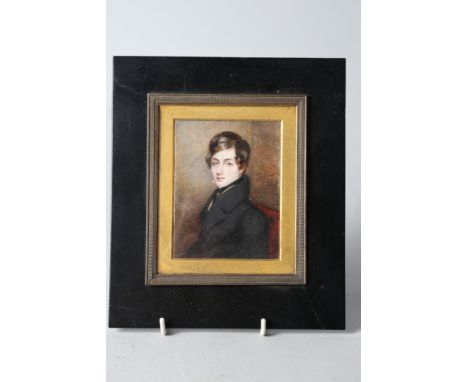 An early 19th century portrait miniature on ivory of an unknown gentleman, 4 3/4" x 3 1/8", in ebonised frame 