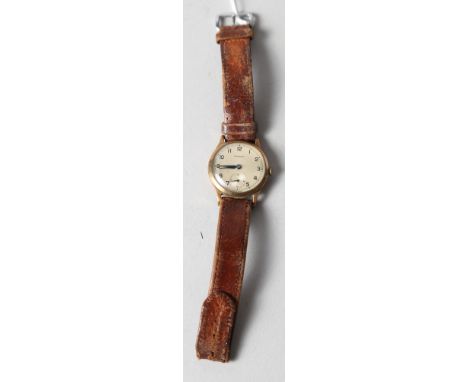 A Garrard 9ct gold cased wristwatch with manual wind movement and silvered dial with Arabic numerals and subsidiary seconds d