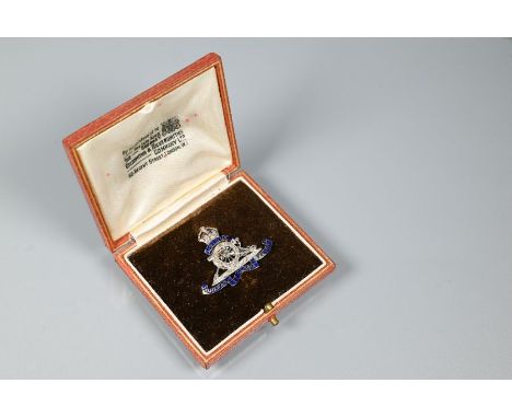 A diamond set Royal Artillery regimental brooch, enamel and white and yellow metal set, 6.7g, in fitted box by George V Golds