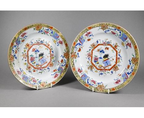 A pair of 18th century Chinese famille rose plates, Qianlong period (1736-95) Qing dynasty, painted in fencai polychrome enam