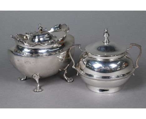 A late Victorian silver sugar basin with hinged lid and shell feet, Chester 1900, to/w another sugar basin and cover, with tw