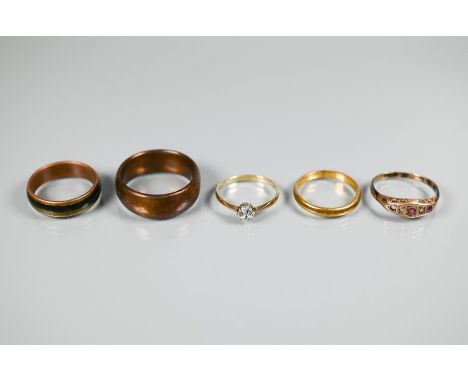 A yellow metal wedding band; rose gold ring set with ruby and diamond, and three other rings (5)