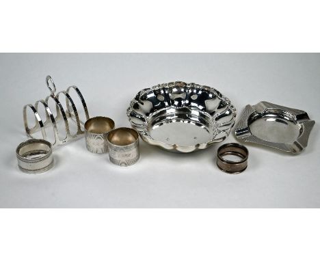 A silver bowl, Birmingham 1962 to/w a toast rack, engine-turned ashtray and four napkin rings (7), 12.6oz (394g)
