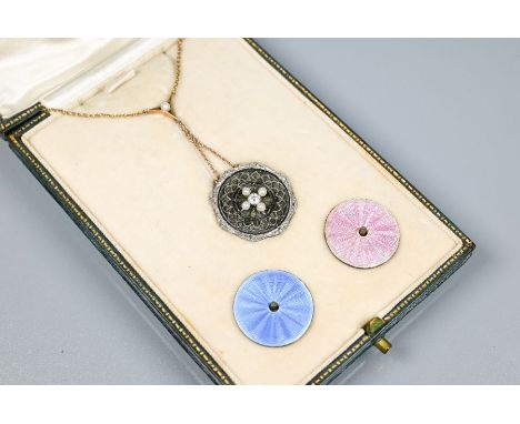 An Edwardian necklace, the circular pendant formed of a fine white metal wirework/filigree surround set with four small pearl