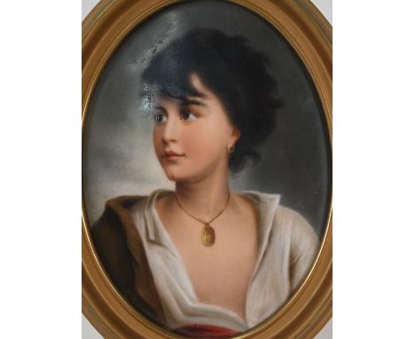 A 19th century German porcelain oval plaque, painted with 'Young Boy from Naples' after Paul Richter, impressed K/1, 19.5 x 1