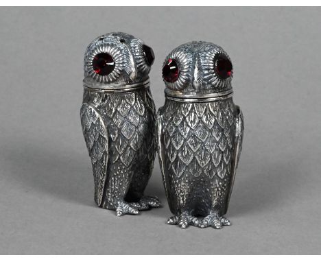 An .800 grade novelty 'Owl' salt and pepper pair with ruby glass eyes