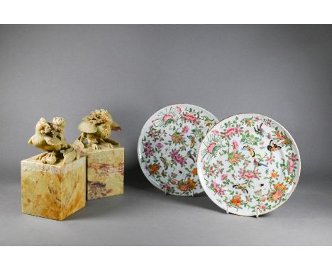 A pair of early 20th century Chinese carved soapstone bookends, over-sized chop seal square form surmounted by a phoenix carr